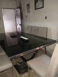 beautiful black glass dining table