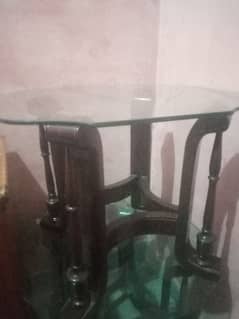 two small glass table and one large table without glass