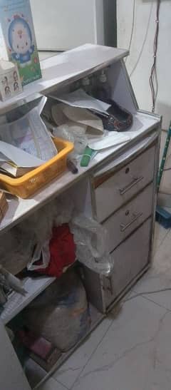 cash counter and glass and wood counter