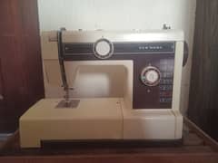 Used but just like brand new sewing machine with cover bag