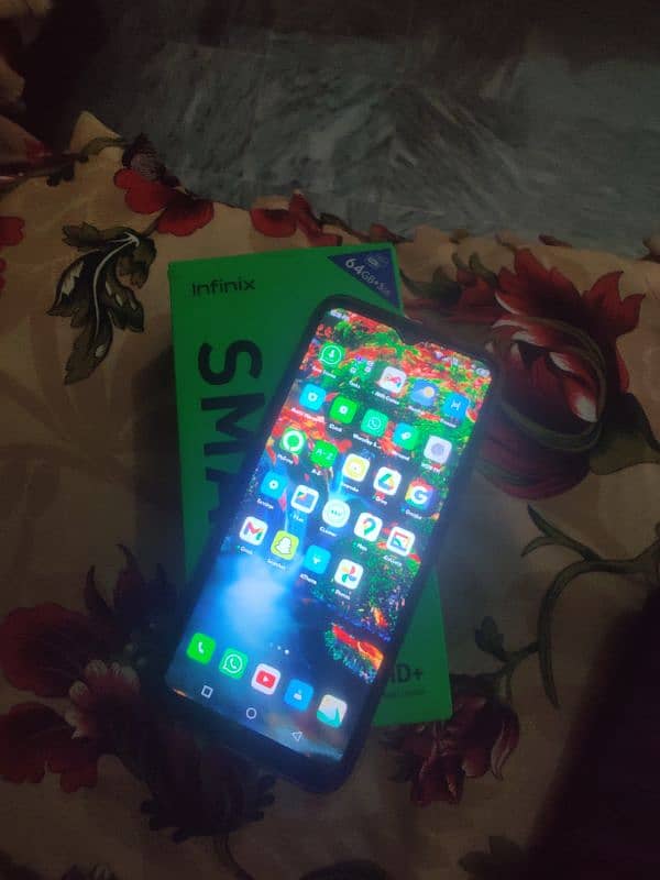 Infinix smart 6 with box and charger 0