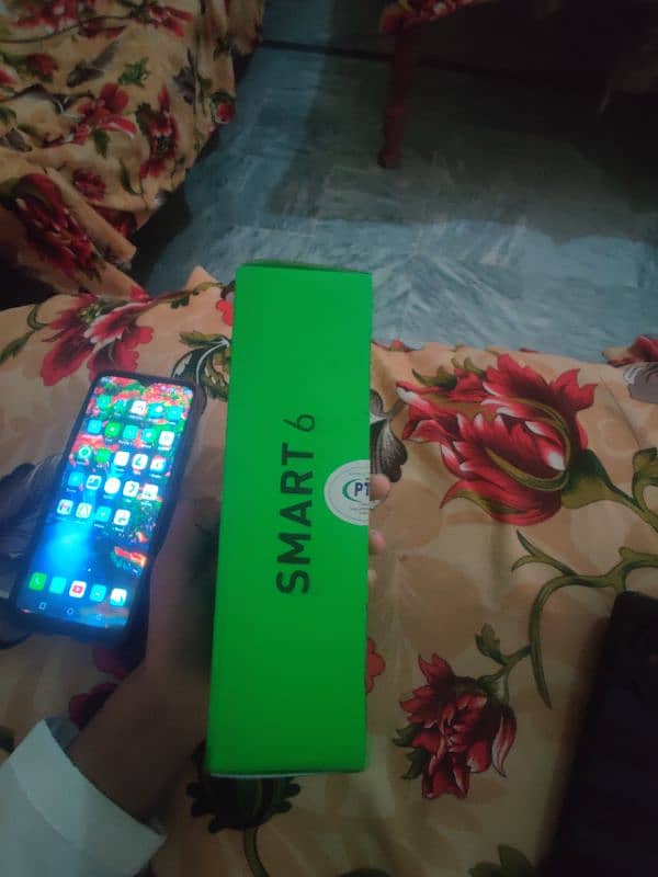 Infinix smart 6 with box and charger 1