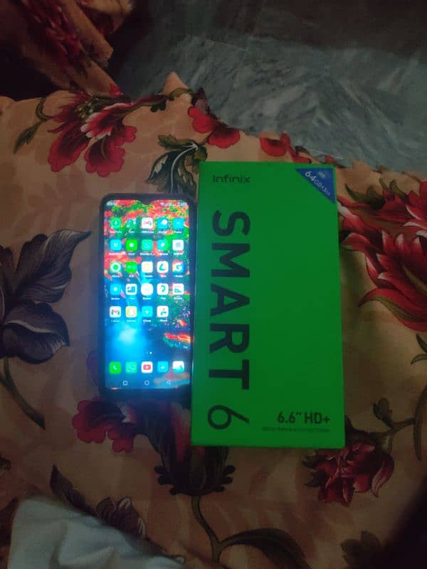 Infinix smart 6 with box and charger 2