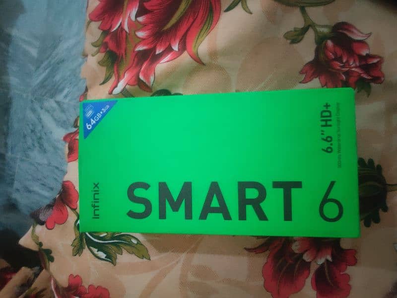 Infinix smart 6 with box and charger 3