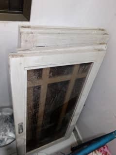 Wooden window for sale with brown glass