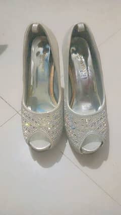 branded silver high heels