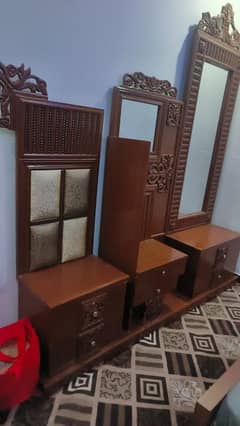 wooden bed with 2 side table and dressing table