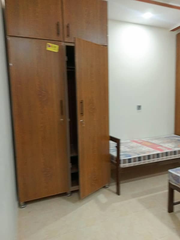 Running hostel building for rent setup for sale in Ali town near orange line station hostels area profitable building 1