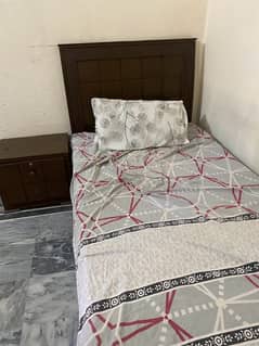 single bed & side table