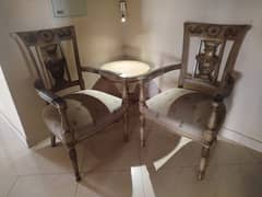 Pair of chairs with round table