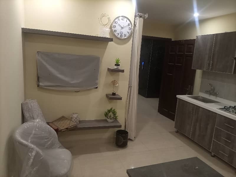 2 BEDROOM FULLY LUXURY FURNISH IDEAL LOCATION EXCELLENT FLAT AVAILABLE FOR RENT IN SECTOR C BAHRIA TOWN LAHORE 13