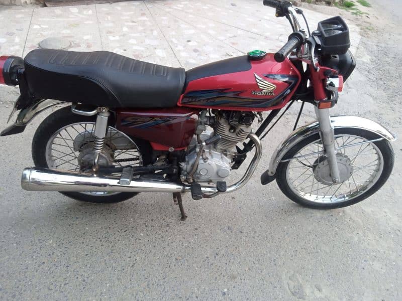 Honda 125 with 69 number 0