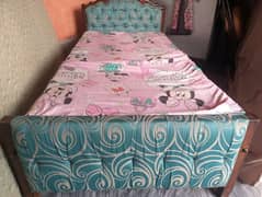 Two used single wooden beds with side tables 0