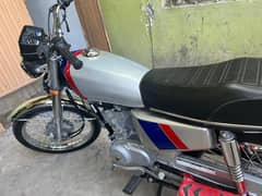 Honda 125 with Golden number