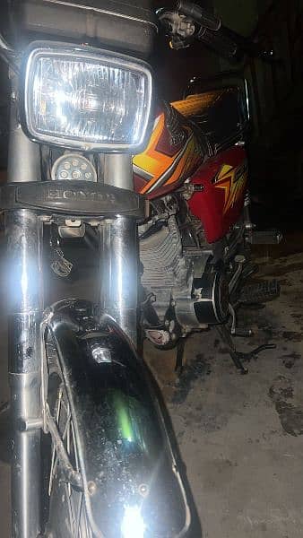 Honda 125 with Golden number 2