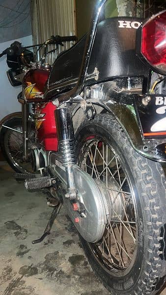 Honda 125 with Golden number 10