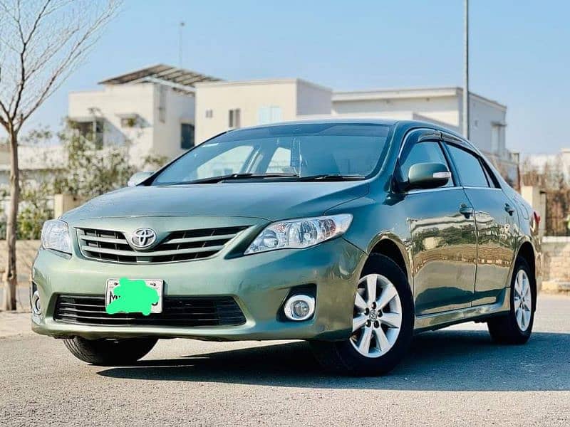 Toyota Corolla GLI 2011 model 12 ka number laga hai 3