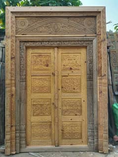 main itnrance solid wooden door & two windows in antique old design