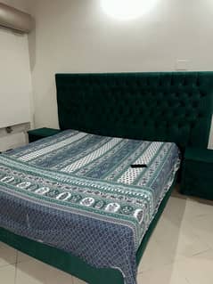 King size bed with side tables and dressing mirror