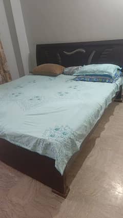 wooden bed with mattress 0