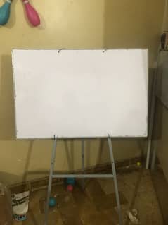 white writing  board with stand