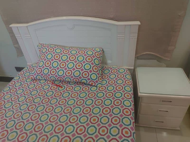 single bed with one side table 2