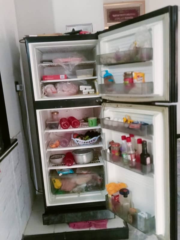 glass door fridge okay condition look like new 3