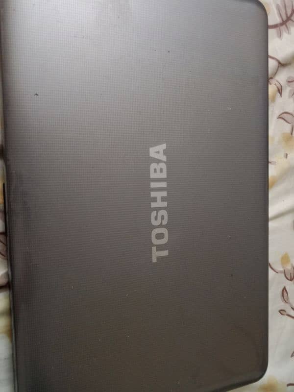 Toshiba laptop with original charger (silver color) 0