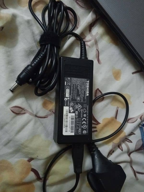 Toshiba laptop with original charger (silver color) 1