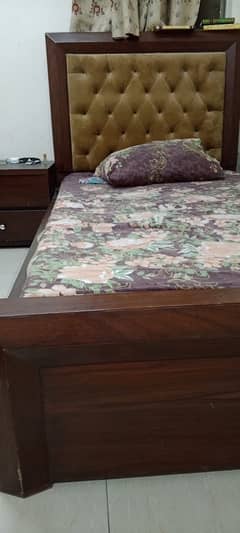 2 single bed with mattresses with one side table