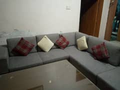 L shaped sofa and table