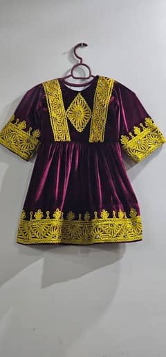 Maroon Velvet dress with golden lace work on it