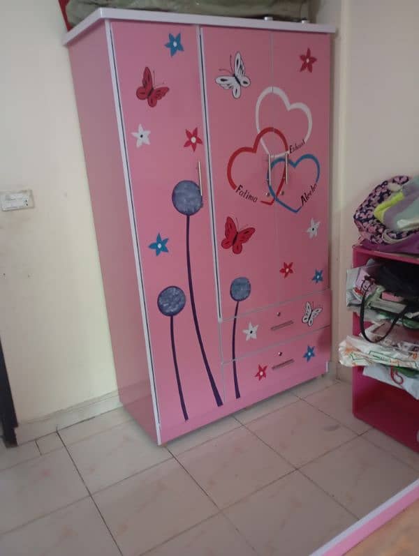 two single bed, cupboard,bookrack,small dressing table for kids 1