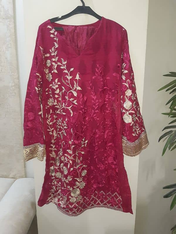 al karam stitched dress in pink color. 1