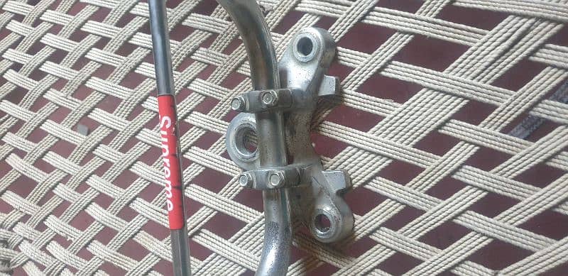 125 janiun bike handle with bracket. 0