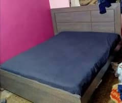 Wooden double bed for sale