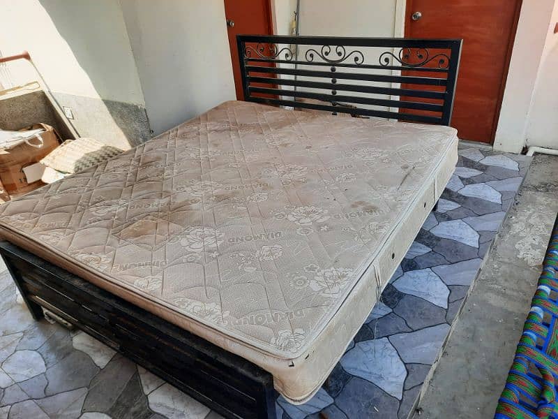 Rot Iron Bed with spring mattress 6ft x 6.5 ft 3