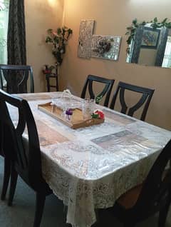 wooden dinning table with six chairs in very good condition