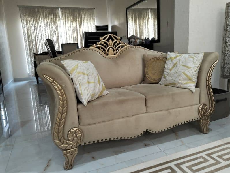 A golden coloured sofa 2