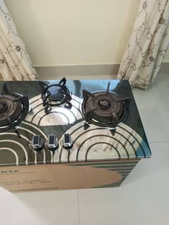 kitchen hob with three burner. sef ignation.