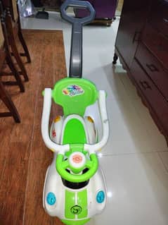 Mini Stroller with push handle for kids in new condition.