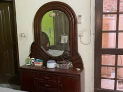 wooden bed with dressing table