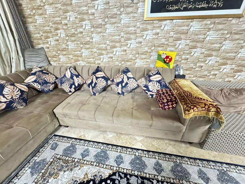 L-shaped and 7 seater sofa with cushions in 70k 1