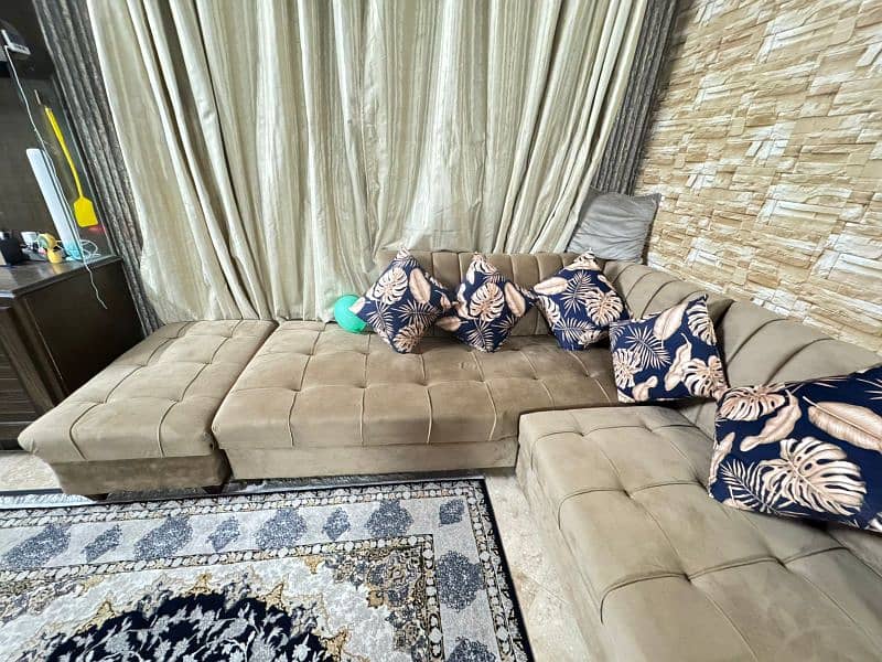 L-shaped and 7 seater sofa with cushions in 70k 2