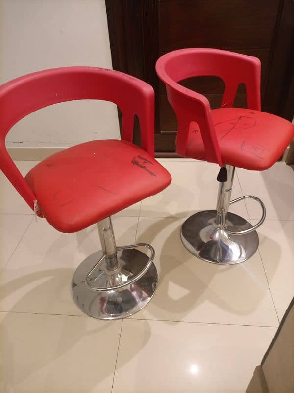 Red revolving chairs 1