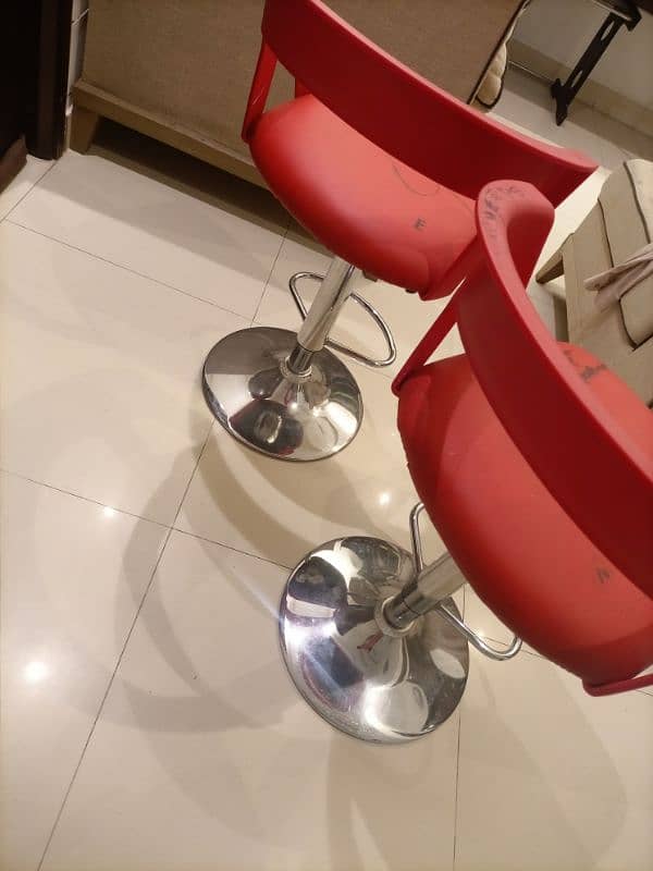 Red revolving chairs 2