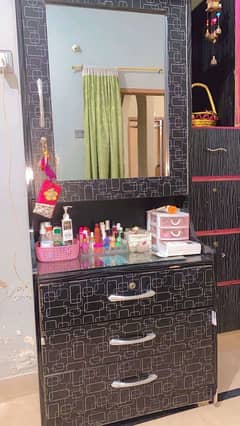 black dressing table along with mirror storage