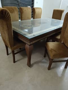 slightly used wooden table with chairs