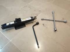 New Car jack, screw opener, wrench. 0