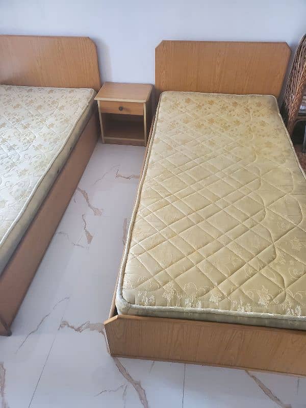 2 single bed with 1 side table is available  for sale 3